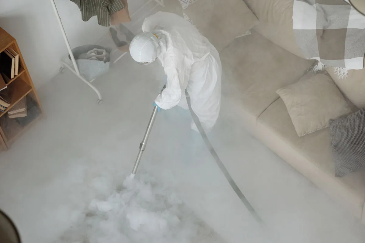 Biohazard cleanup technician in protective equipment, South Wilton, CT